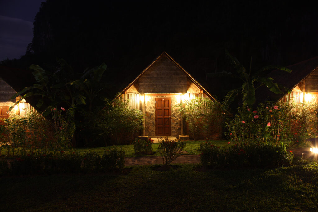 a photgraph of a country style cottage at night